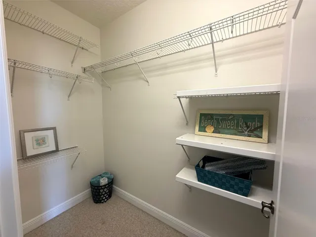 Walk-In Closet In The Primary Bedroom