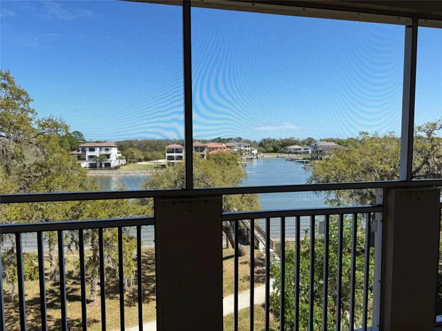 UNSTAGED TILED PATIO: The Patio Has Unrivaled Water Views