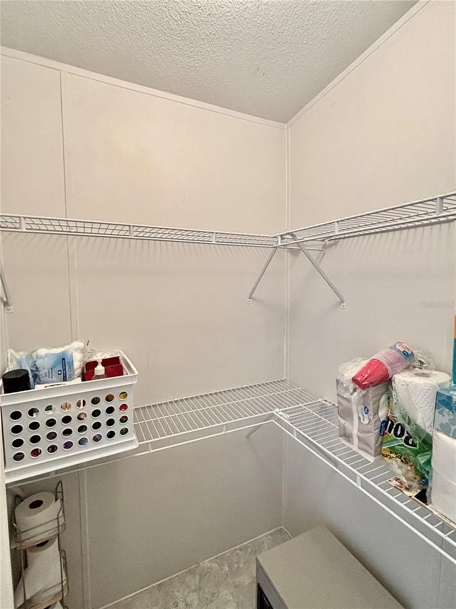 Primary bathroom walk-in closet view