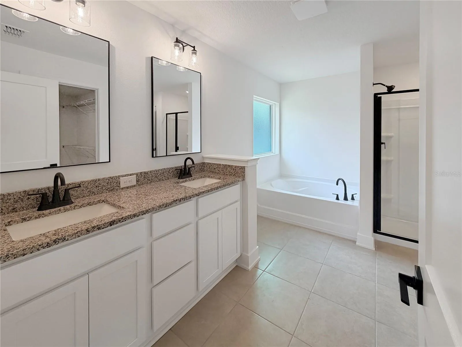 Owner Bathroom with double Sink, Black fixtures