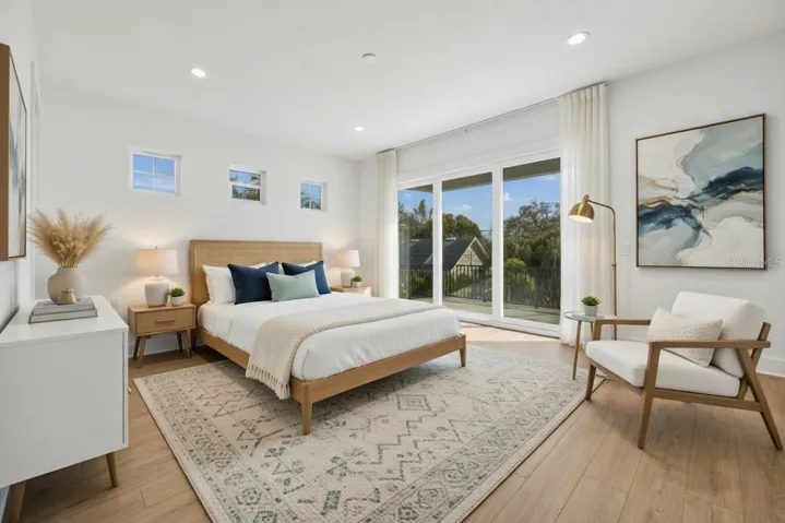 Primary suite with cascading sliders leading to patio deck