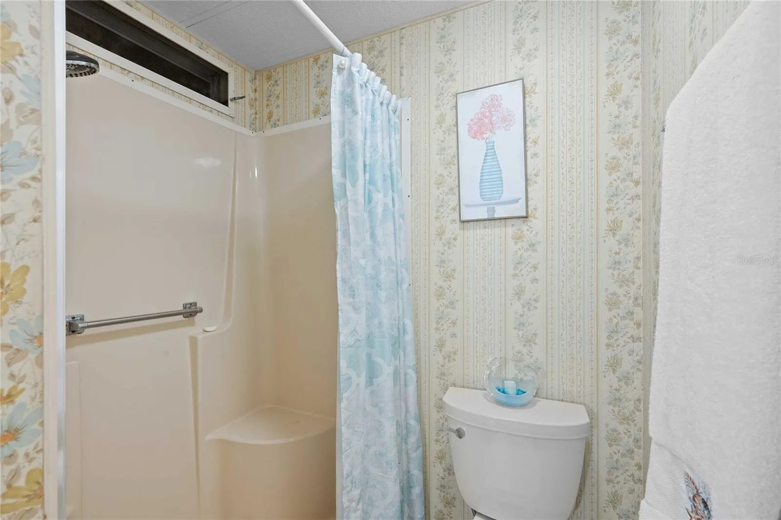 Primary retreat has step-in shower.