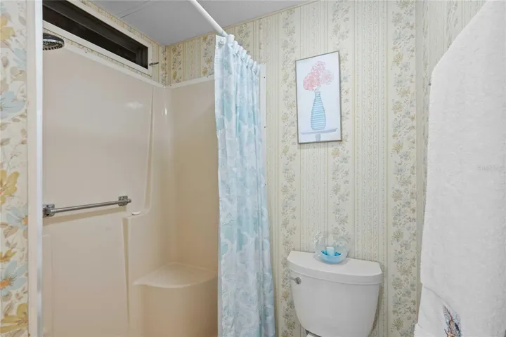 Primary retreat has step-in shower.