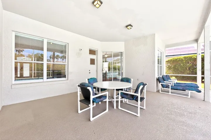 Step outside to your private retreat, where a covered patio and screened lanai enclose the SPARKLING IN-GROUND POOL AND SPA, offering the perfect setting for relaxing or entertaining year-round.
