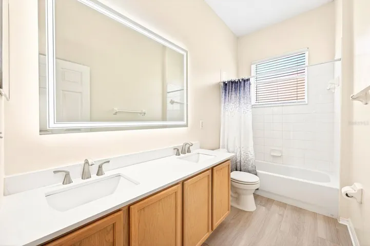 The main floor also includes three additional bedrooms and another full bath.