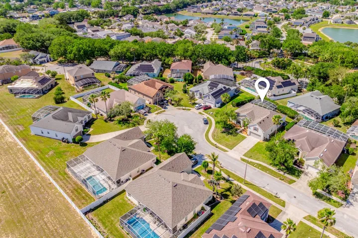 Aerial view of the front of the home and community.