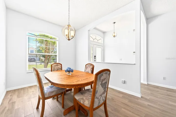 Inside, a separate Living Room and Dining Room provide ELEGANT SPACES for entertaining.