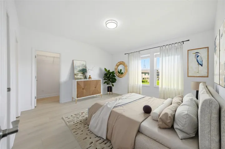 master bedroom with large walk-in closet