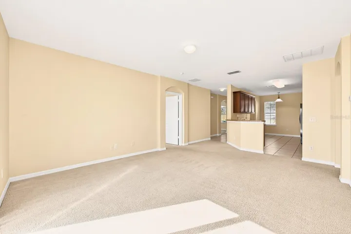 Light, bright living area is open to the kitchen.