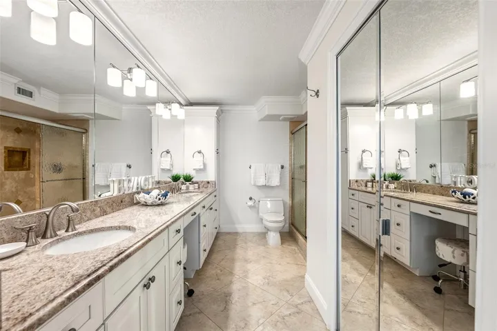 Ensuite with Mirrored Walk-In Closet