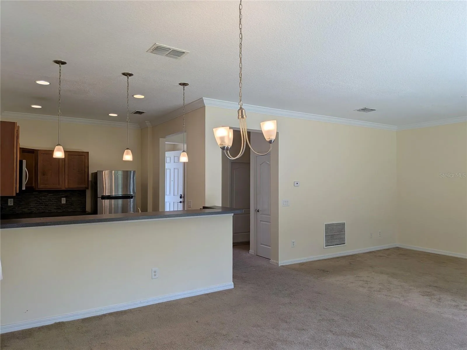 view of kitchen and living room from dining room