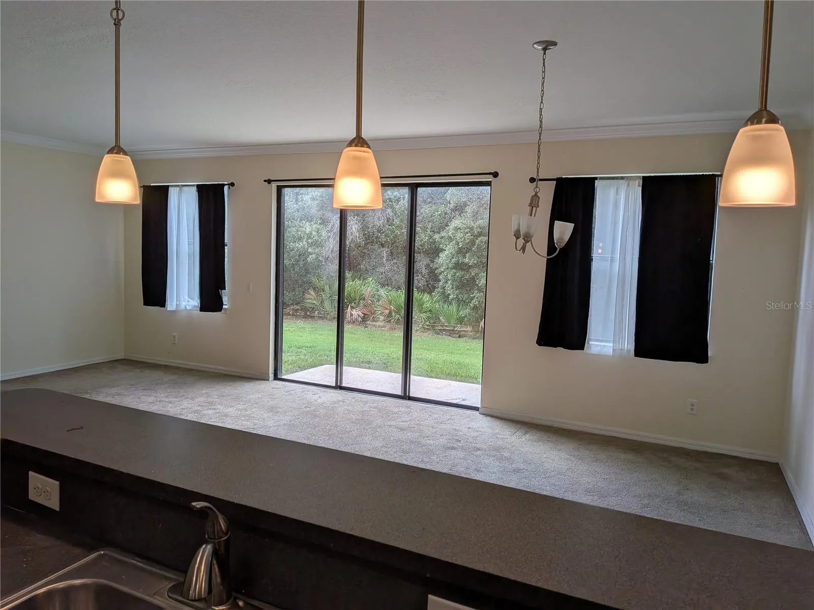 view from Kitchen to Living / dining room combo