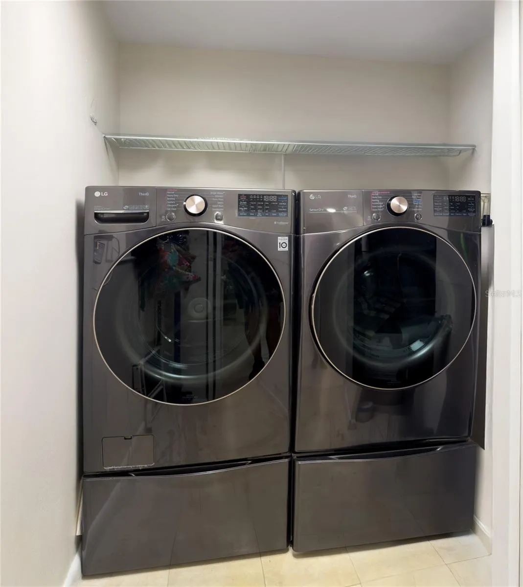 Laundry room with Newer Washer and Dryer that convey