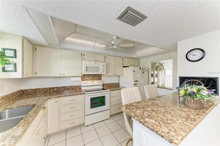 Kitchen with plenty of cabinets and a pantry.