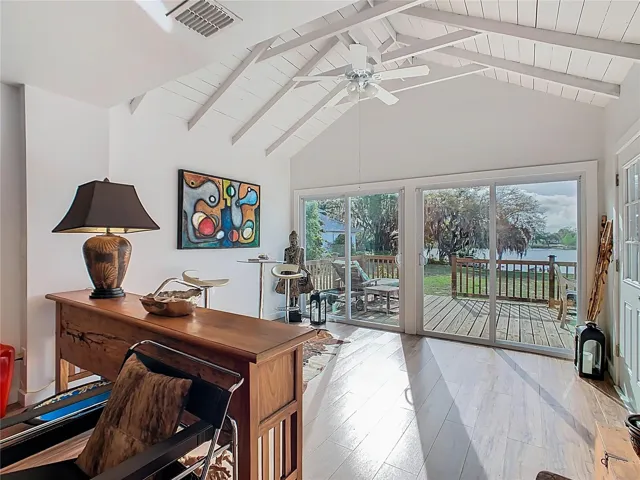 Large sliding glass door offer an amazing lake front view of Saint Anne Lake