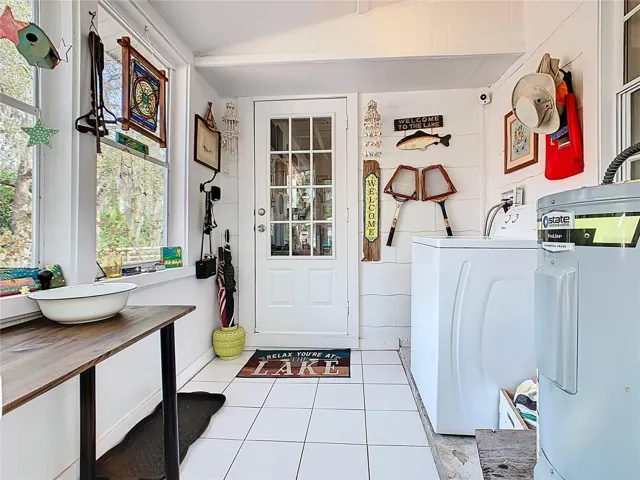 Entry from the back door with laundry area.