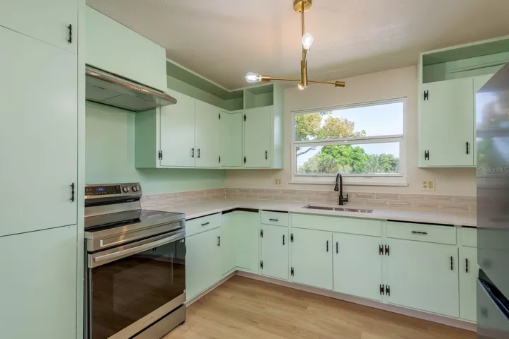 Guest / in-law apartment full kitchen with al wood retro cabinets and modern quartz counters, upstairs