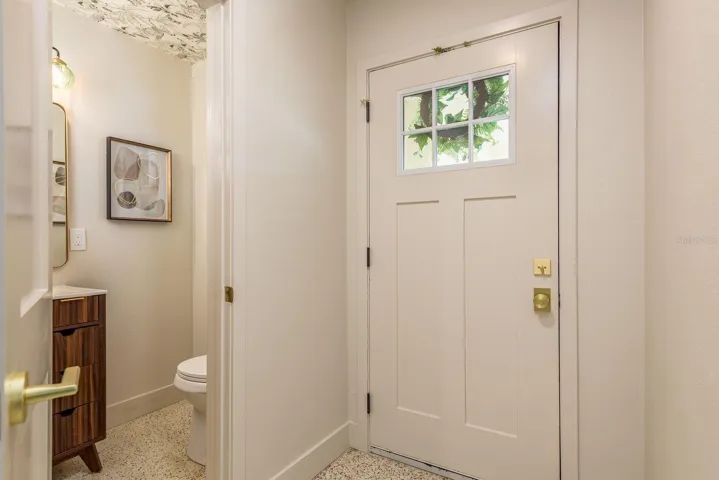 Foyer entrance and guest half bath/powder room