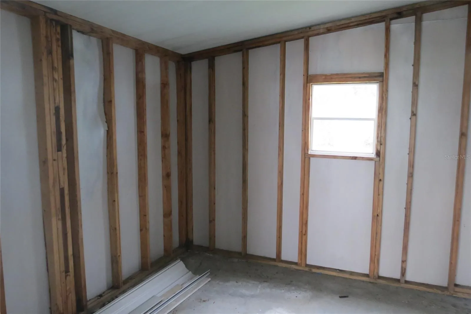 Storage shed off carport area