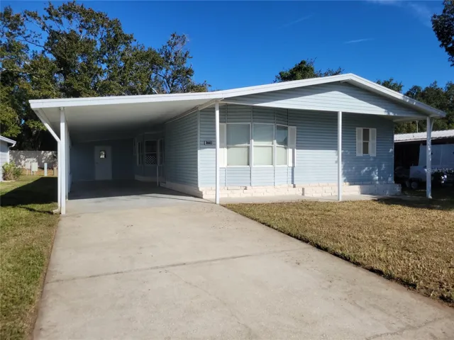 Storage shed off carport area