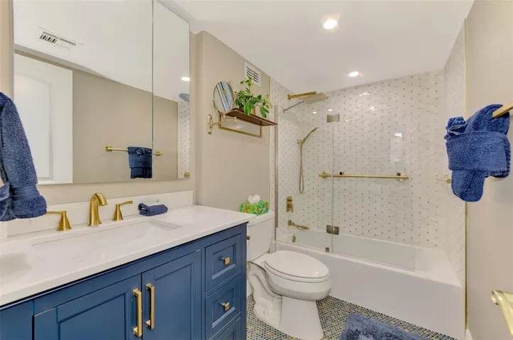 WOW, THIS BATH IS FABULOUS! BLUE WHITE, GOLD FIXTURES, DONE SO SO WELL!