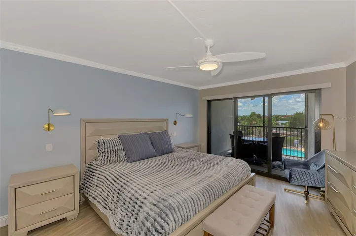 MASTER  BEDROOM WITH GLASS DOORS STO THE LANAI OVERLOOKING THE POOL!