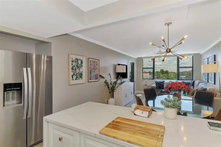 VIEW FROM KITCHEN OVERLOOKING DINING AND LIVING ROOM,