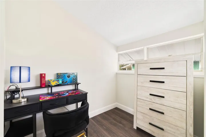 Fourth bedroom features a built-in closet and large walk-in closet that can also be used as an office/study area.