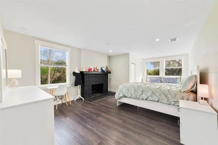 Spacious third bedroom is complete with a fireplace.