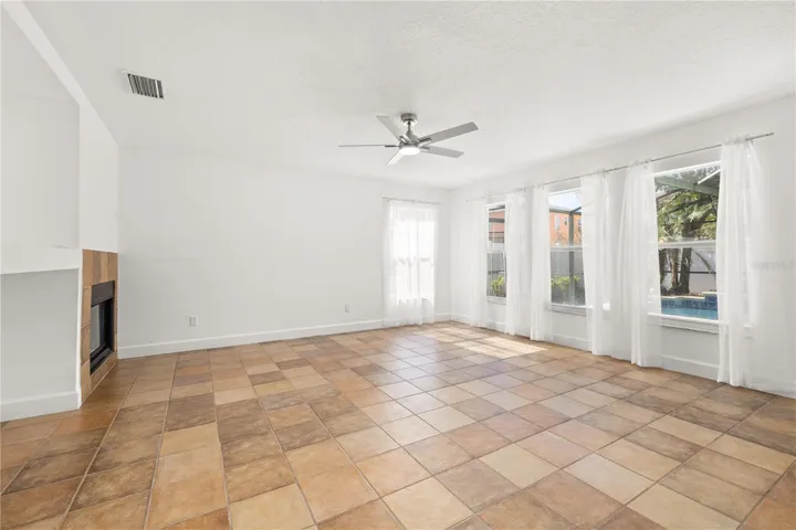 Rear family room with fire place and new fan