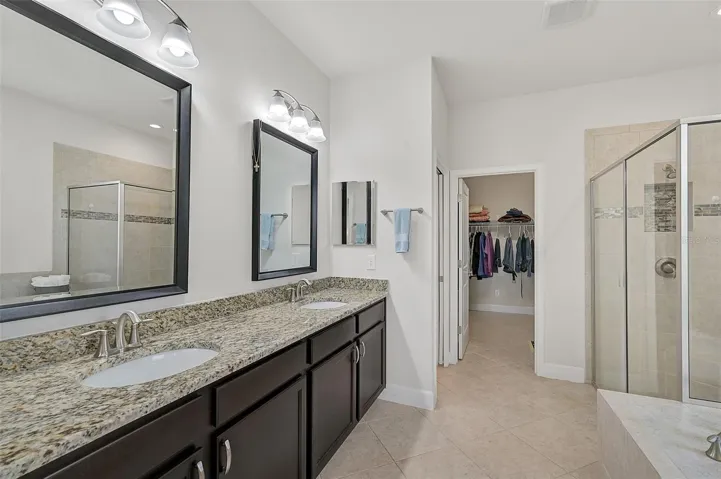 Dual sinks and large walk-in shower. Nice soaking tub too!