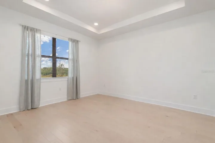 Primary Bedroom with view of pond