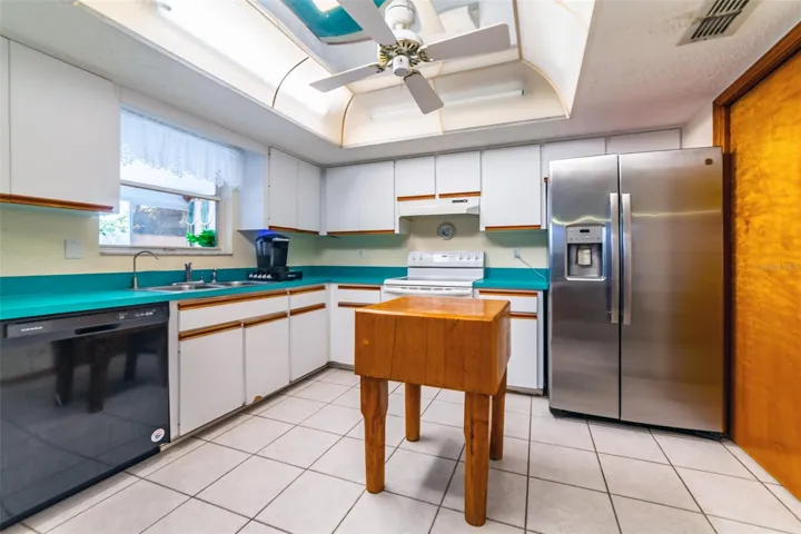 KITCHEN - BRIGHT WITH PASS THRU WINDOW TO PATIO