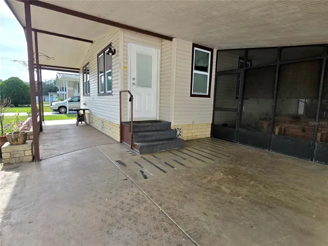 Covered front patio, carport &amp; screen porch.