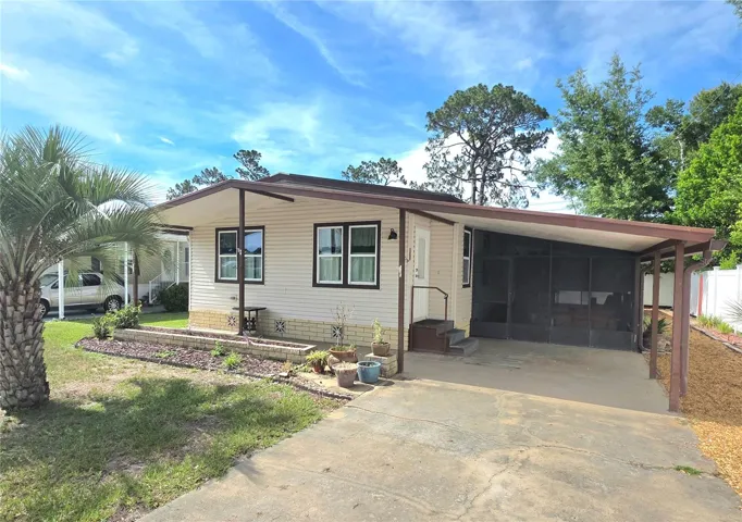 Driveway, carport, main entry to living room &amp; screen porch.