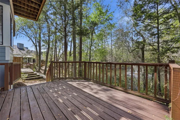 WOOD DECK OVERLOOKS THE POND & WATER FOUNTAIN