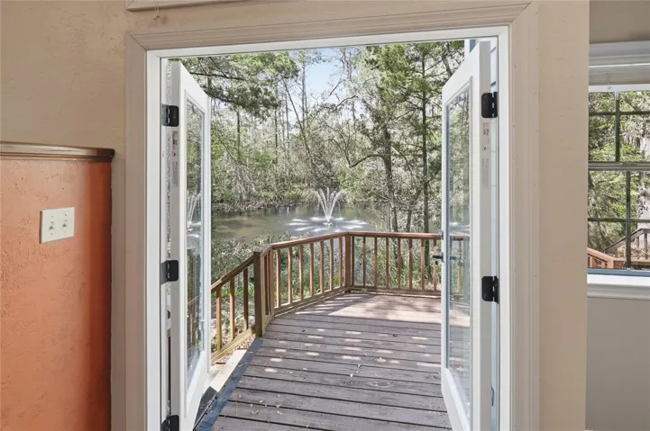 DOUBLE DOORS TO WOOD DECKING PORCH