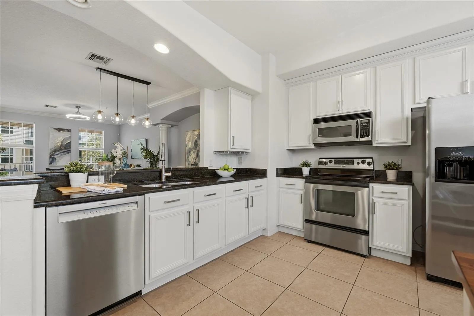 Kitchen opens directly to the dining and living spaces for an easy, connected layout.