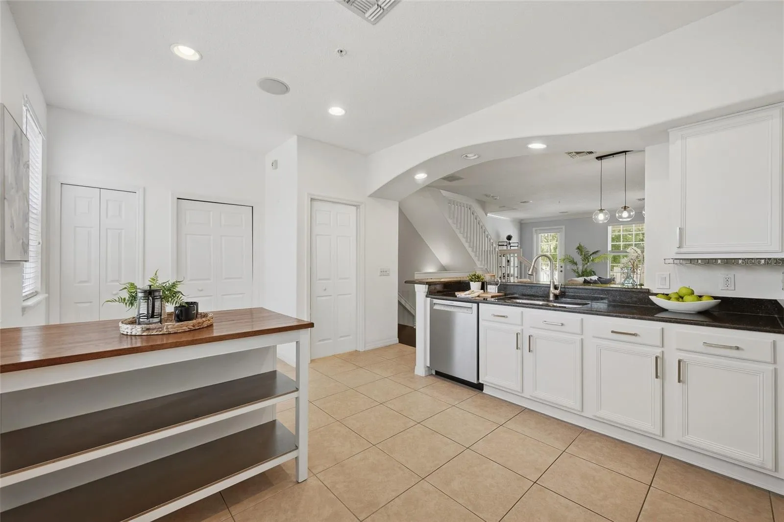 Light-filled kitchen with ample space for casual dining or a breakfast table.
