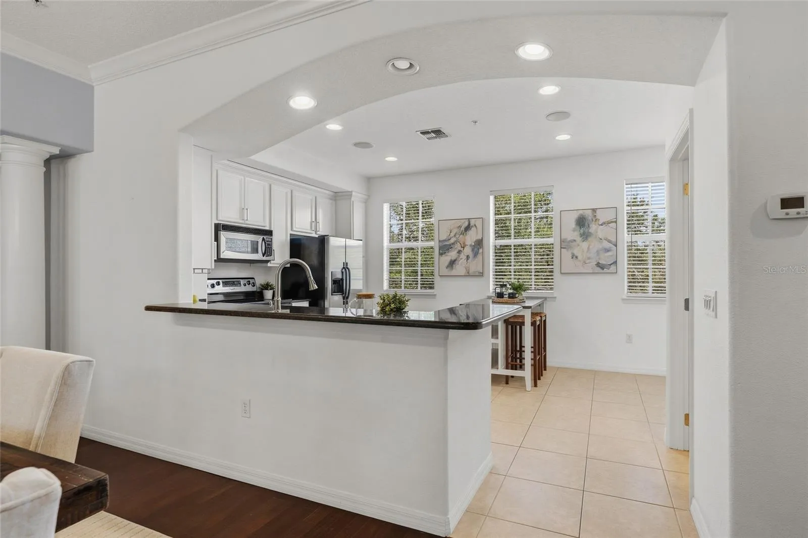 Bright kitchen with abundant natural light, generous counter space and an open connection to the dining area.