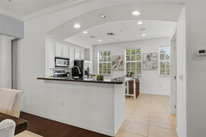 Bright kitchen with abundant natural light, generous counter space and an open connection to the dining area.