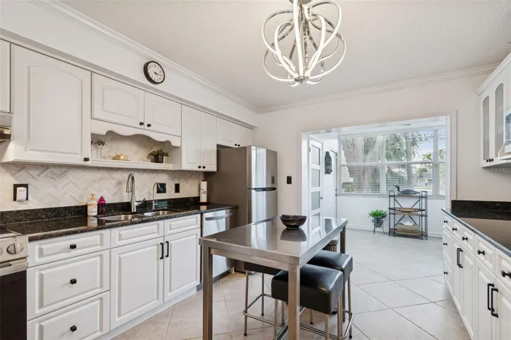 Kitchn with view of Sun Room/Office Area