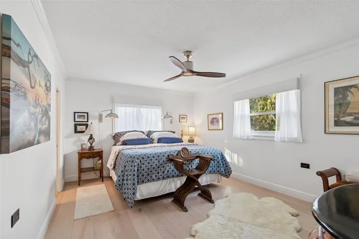 Primary Bedroom with Wood Flooring
