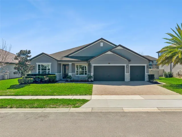 Front exposure with your paver driveway and 3 car garage.