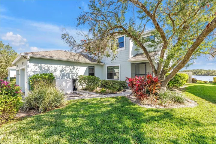 Gated Caya Costa Beautifully Landscaped End Unit Townhome with Oversized Lot 48’ x 105’
