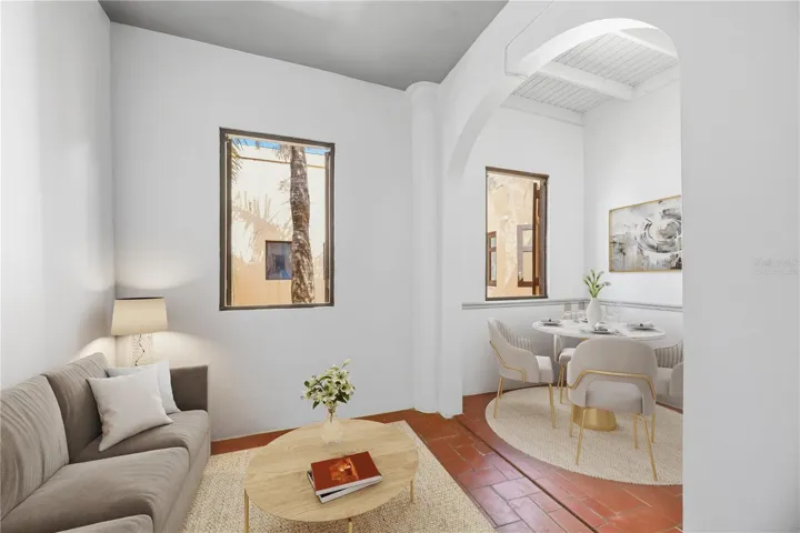 Apartment II's Living and Dining Area - This image has been virtually staged and does not reflect the current state of the property.