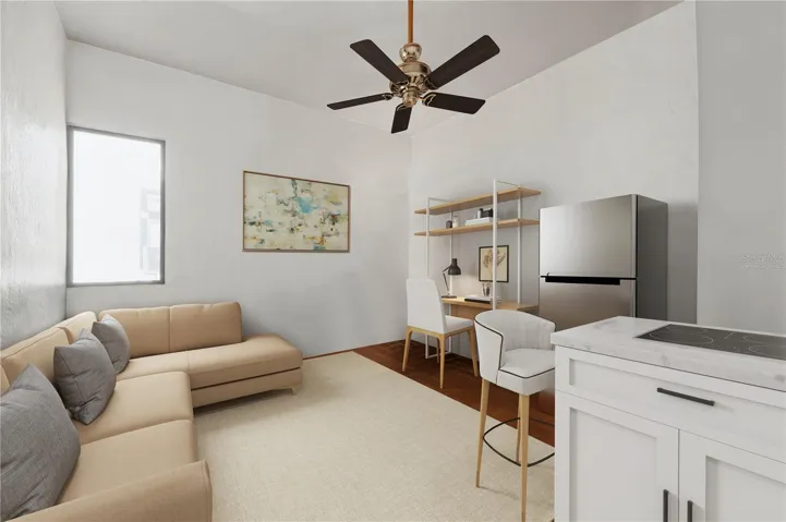 Apartment I's Living Area and Kitchen - This image has been virtually staged with a conceptual kitchen remodel and does not reflect the current state of the property.