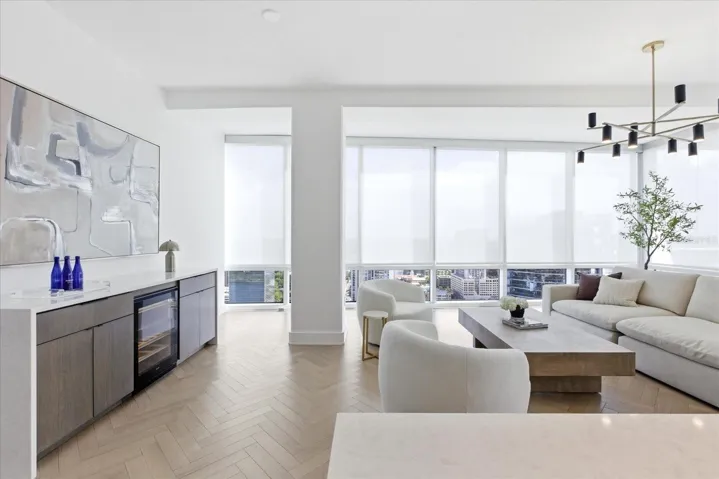 Rift oak and quartz extend - creating a rich backdrop that brings depth and dimension to the living space.