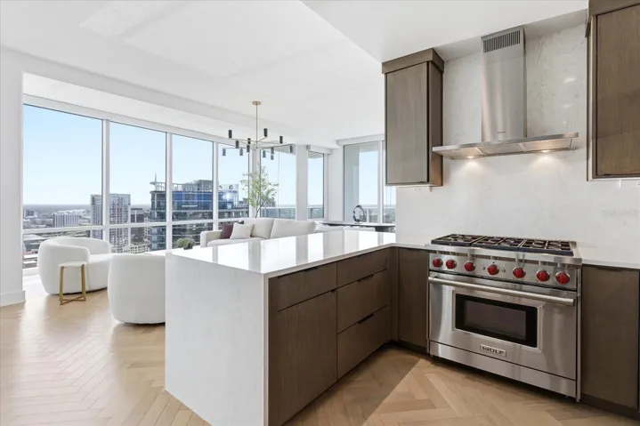 From the kitchen, the home opens in one continuous view - where cooking, dining and living come together with an effortless sense of ease.