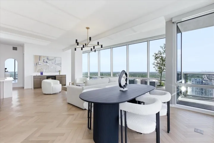 Set at the dining table, this is where the home invites your to linger - gathered with the skyline just beyond and the living space surrounding you.